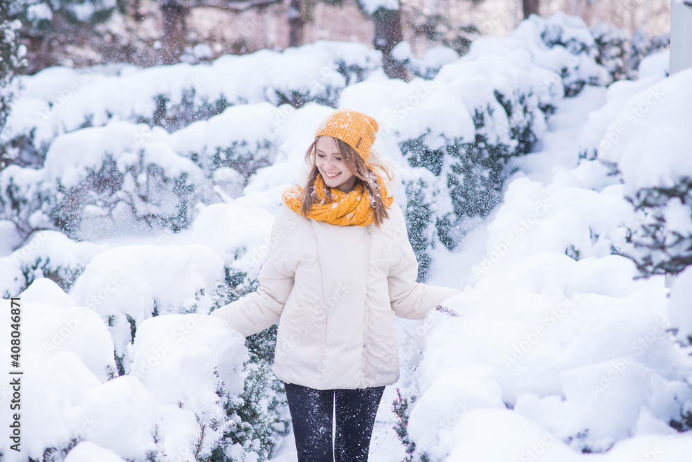 Portrait of a happy smiling girl on a snowy winter day Portrait of a happy smiling girl on a snowy winter day