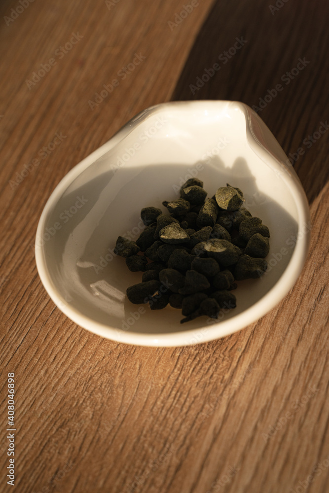 Ginseng root tea in a chahe on a wooden table. Traditional Chinese tea ceremony. Mind and body relax with a drink. Ginseng root tea in a chahe on a wooden table. Traditional Chinese tea ceremony. Mind and body relax with a drink.