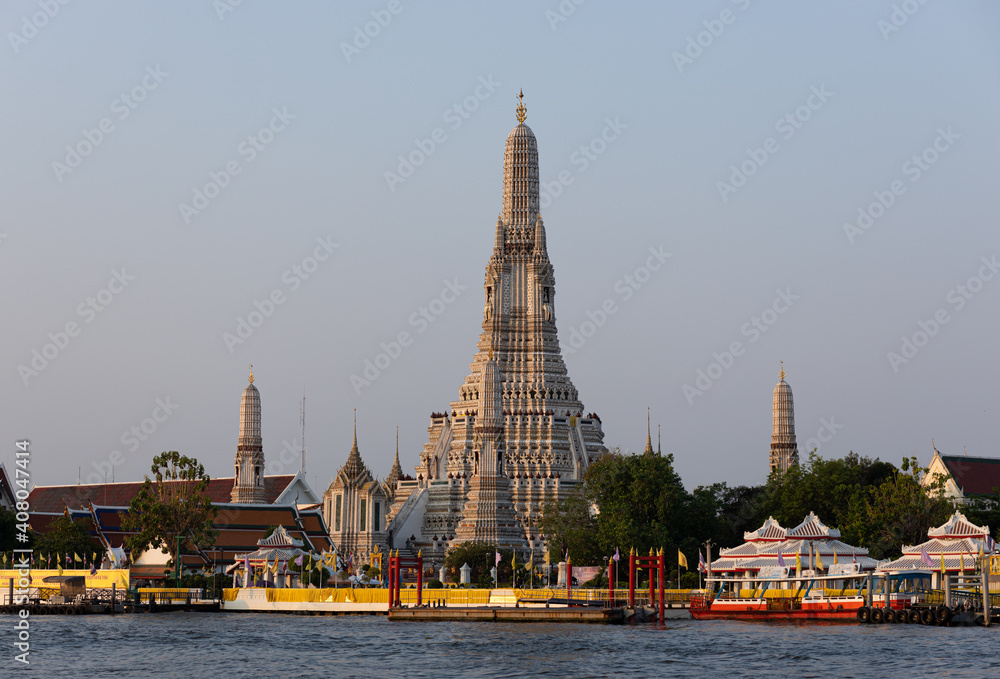 View of Wat Arun Temple from the Chao Phraya river. Buddhist temple in Bangkok, Thailand 