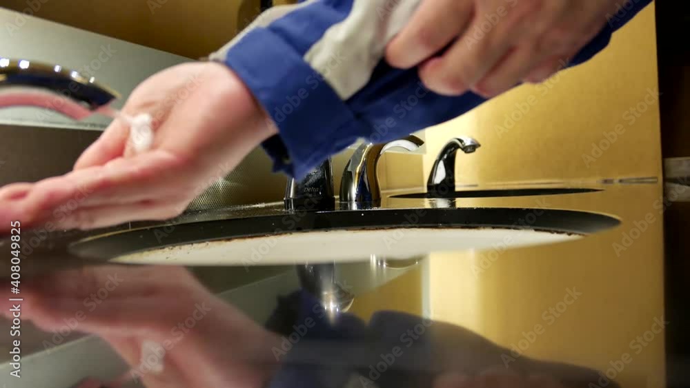 Man washing hands in a public washroom inside Hard Rock Casino with 4k resolution Man washing hands in a public washroom inside Hard Rock Casino with 4k resolution