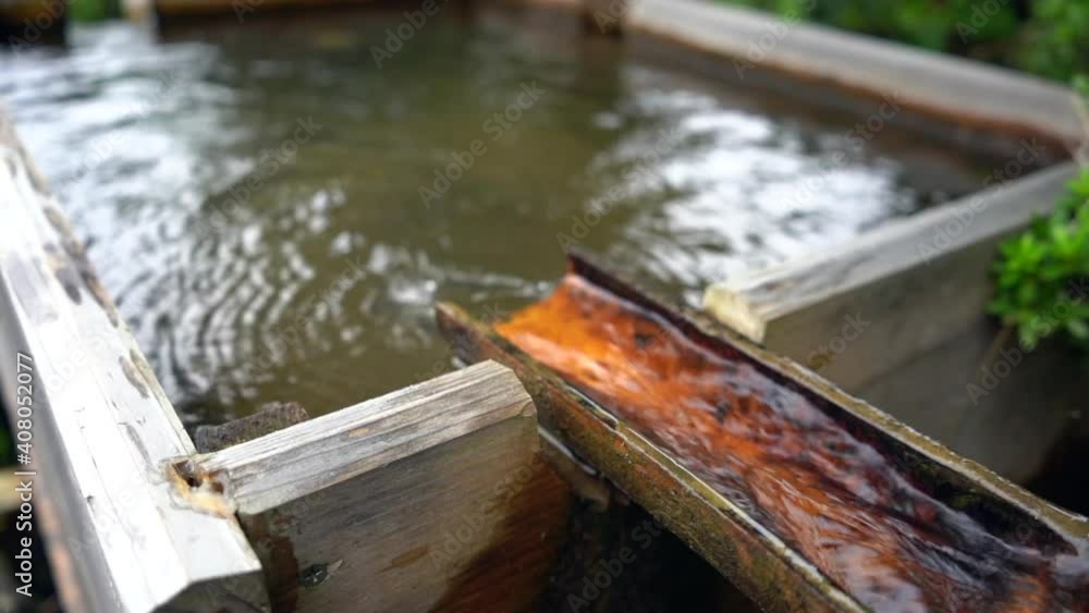 The slow motion of water flow to the wooden box. The slow motion of water flow to the wooden box.