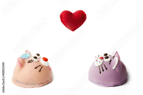 cookies in icing in the form of animals cats and mice with heart on white background © serhio777