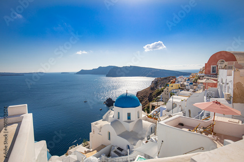 Santorini island, Greece. Amazing summer vacation landscape, white architecture and blue sea view over the caldera. Famous travel destination, urban travel background. Leisure lifestyle travelling
