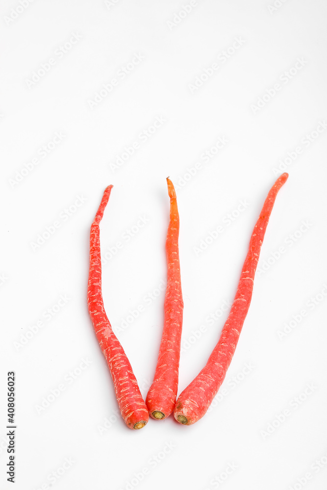 Fresh red carrot bunch on white background Fresh red carrot bunch on white background