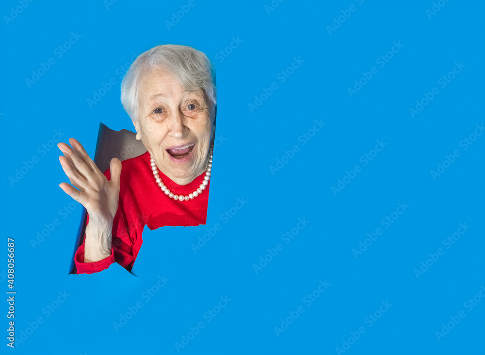 Surprised woman looking through hole in paper wall. Surprised woman looking through hole in paper wall.