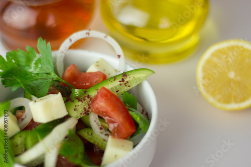 Green salad with onion  parsley  cucumber  tomato and feta cheese