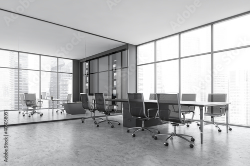 Grey conference room with modern furniture and window