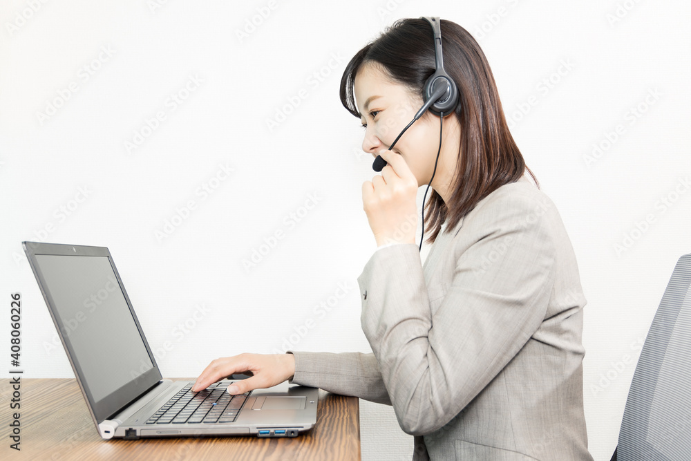 Woman wearing a headset and having a web conference Woman wearing a headset and having a web conference