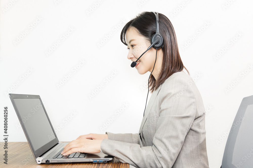 Woman wearing a headset and having a web conference Woman wearing a headset and having a web conference