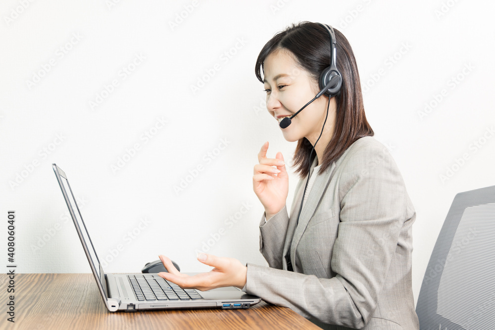 Woman wearing a headset and having a web conference Woman wearing a headset and having a web conference