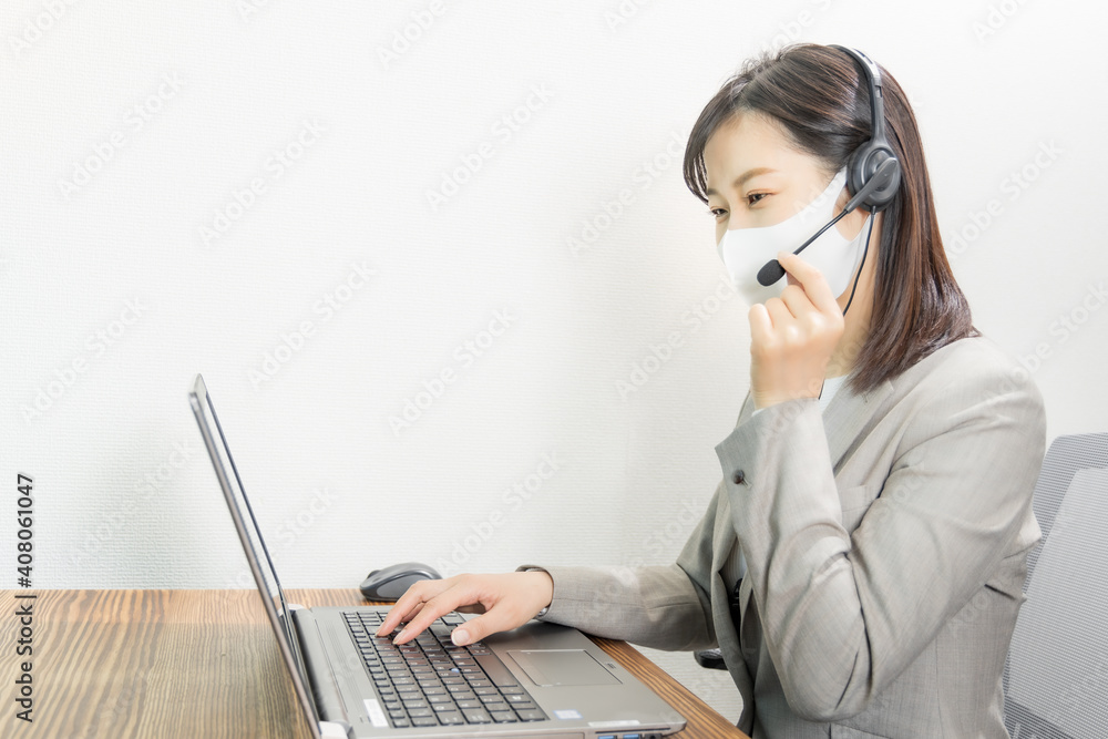 Woman wearing a headset with mask and having a web conference Woman wearing a headset with mask and having a web conference