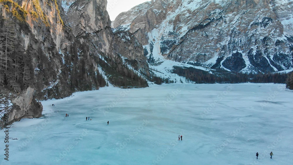 Fototapeta premium Braies Lake blotted in winter, aerial view from drone, Italian Alps
