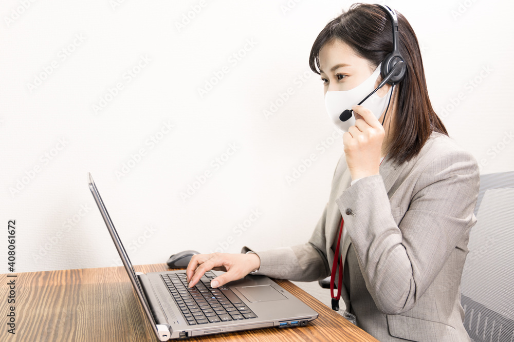 Woman wearing a headset with mask and having a web conference Woman wearing a headset with mask and having a web conference