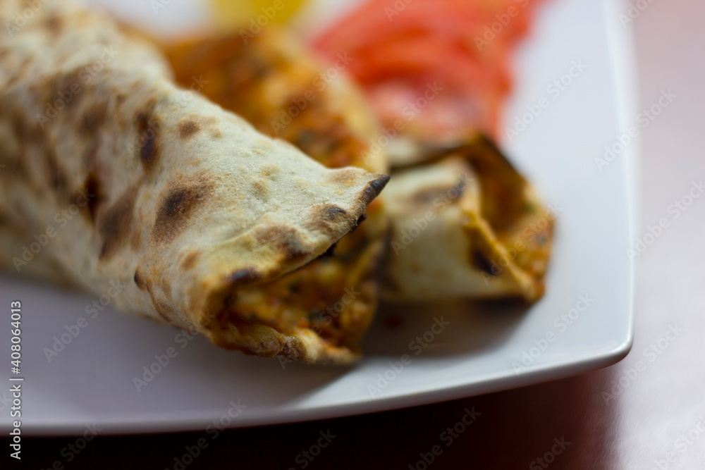 Traditional Turkish pizza (lahmacun) in a white plate Traditional Turkish pizza (lahmacun) in a white plate