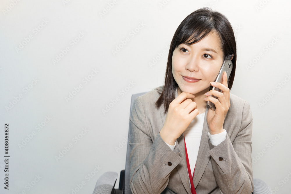Woman making a work call on a mobile phone Woman making a work call on a mobile phone