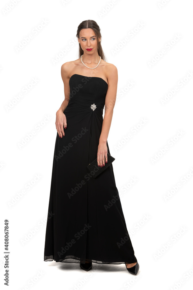woman in an elegant black dress standing isolated on white background