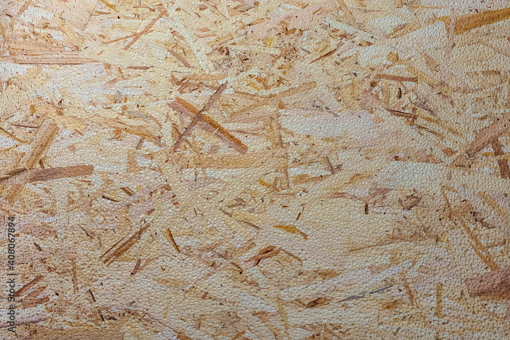 The texture of a wooden sheet of pressed sawdust with dew drops. Background for design. The texture of a wooden sheet of pressed sawdust with dew drops. Background for design.