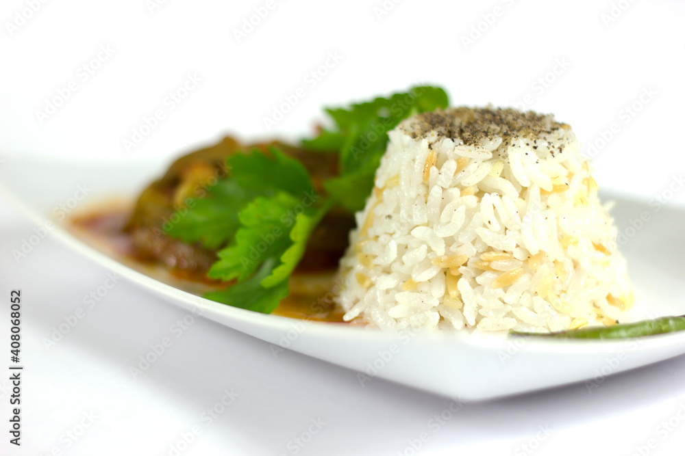 Rice pilaf and okra in a white plate Rice pilaf and okra in a white plate