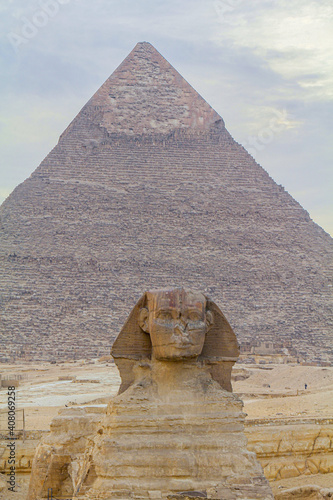 Sphinx sculpture and the Cheops pyramid in Giza, Egypt photo