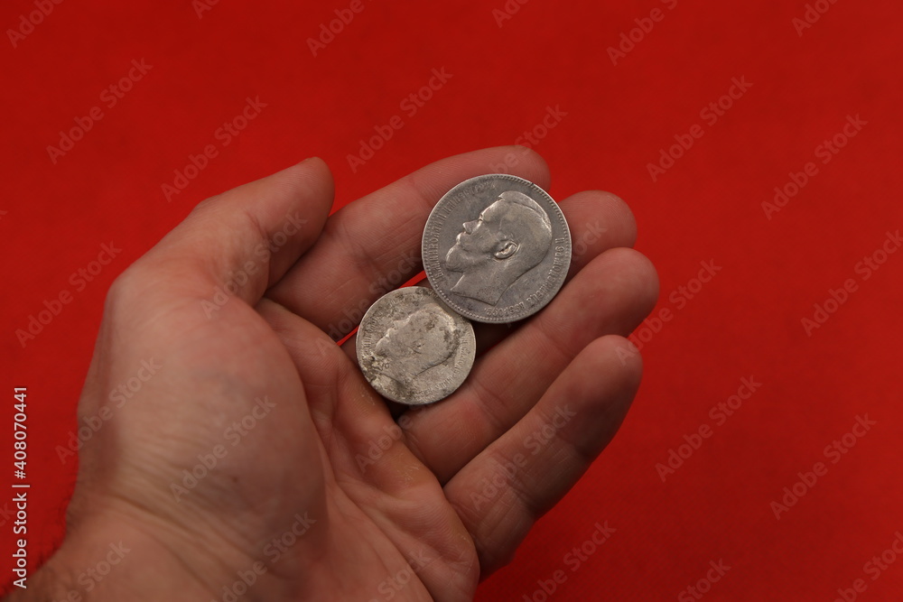 Old Russian silver coins in hand Old Russian silver coins in hand