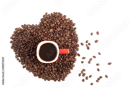 Black coffee in a red cup on the heart shape of beans isolated on white background.
