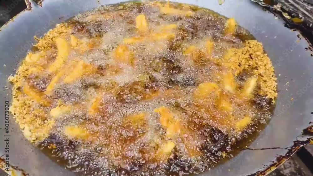 Deep Fried Banana Kuih Cooked In Frying Oil - Close Up Deep Fried Banana Kuih Cooked In Frying Oil - Close Up