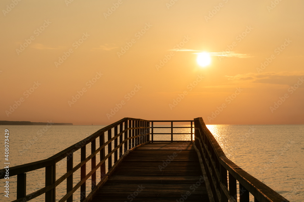 Romantic sea pier with golden sunrise, seaside image, seascape texture