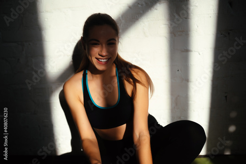 Portrait of beautiful woman. Happy fit girl in sportswear laughing © teksomolika