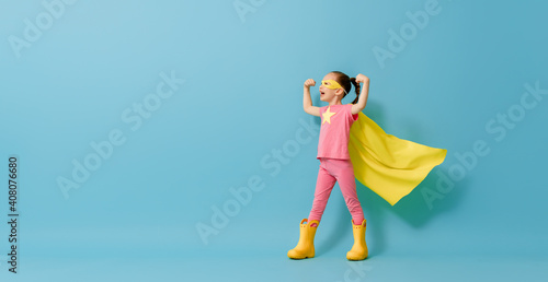 child playing superhero