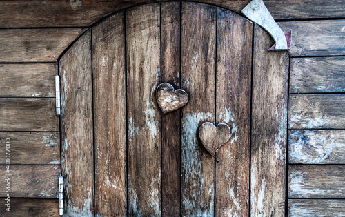 At the heart of two leds that is etched on the wooden door
