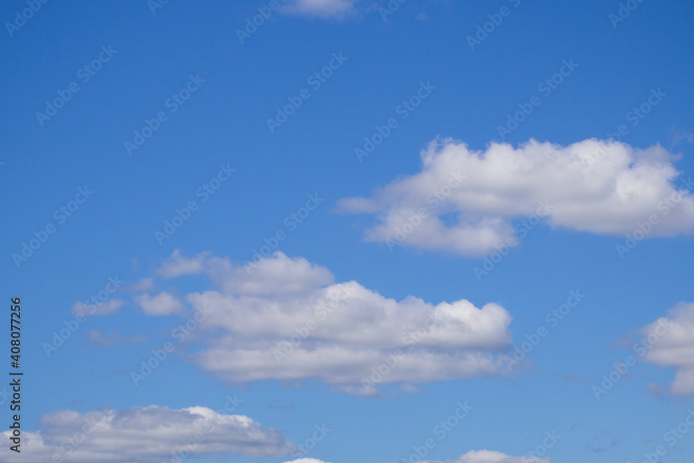 white fluffy clouds in the blue sky white fluffy clouds in the blue sky