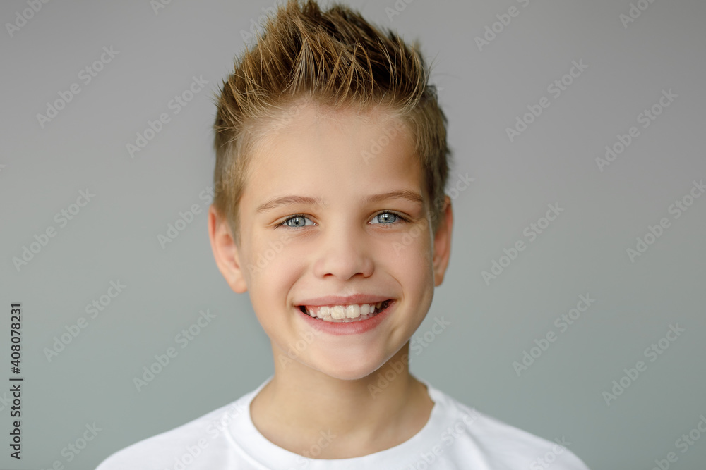 The child smiles and shows jagged teeth. Dental medicine and healthcare The child smiles and shows jagged teeth. Dental medicine and healthcare