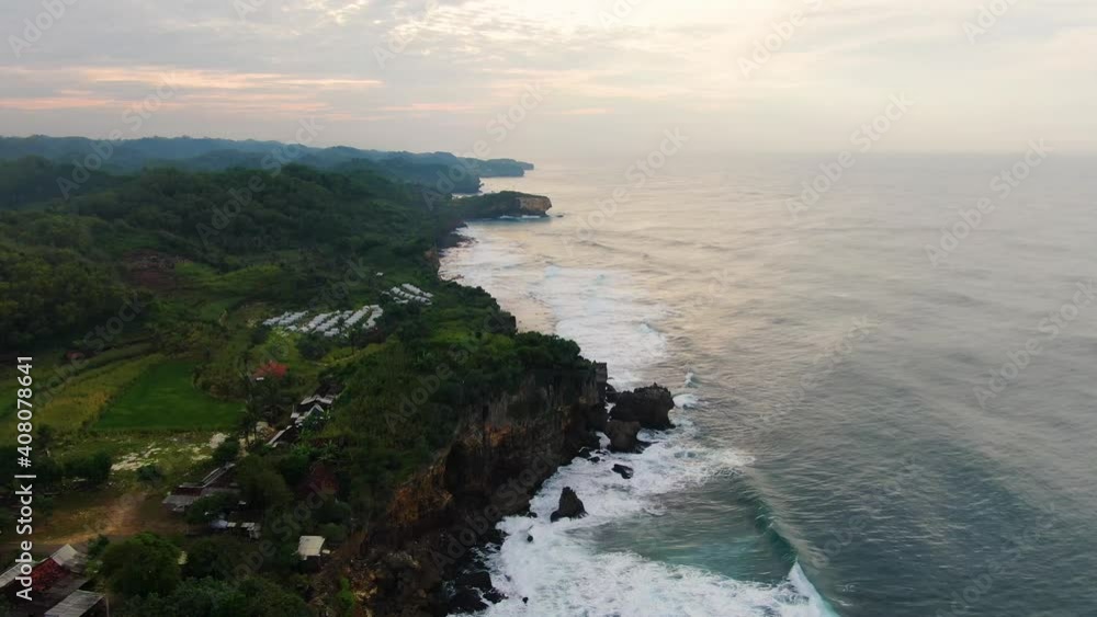 Aerial view on cliffs on southern shore of Java Island, Indonesia at sunset Aerial view on cliffs on southern shore of Java Island, Indonesia at sunset