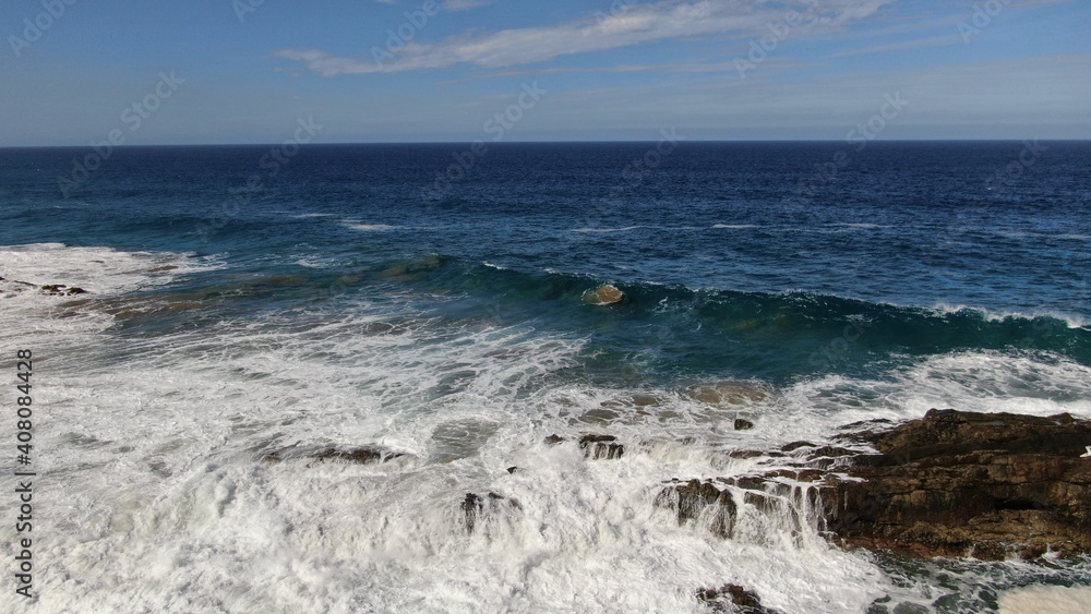 The sea hits the cliffs