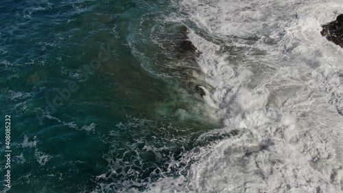 The sea hits the cliffs