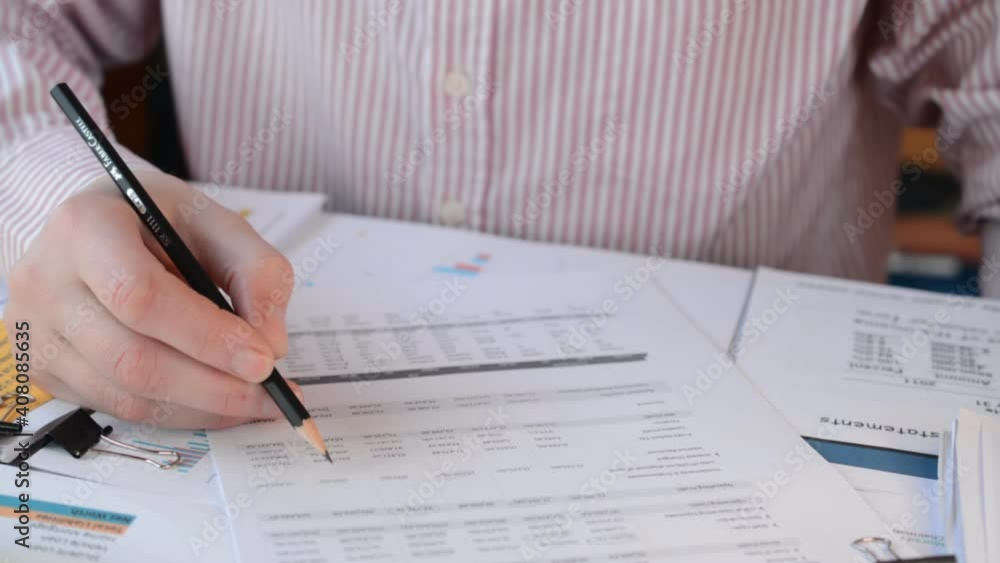 Businessman checks financial performance of his company Businessman checks financial performance of his company
