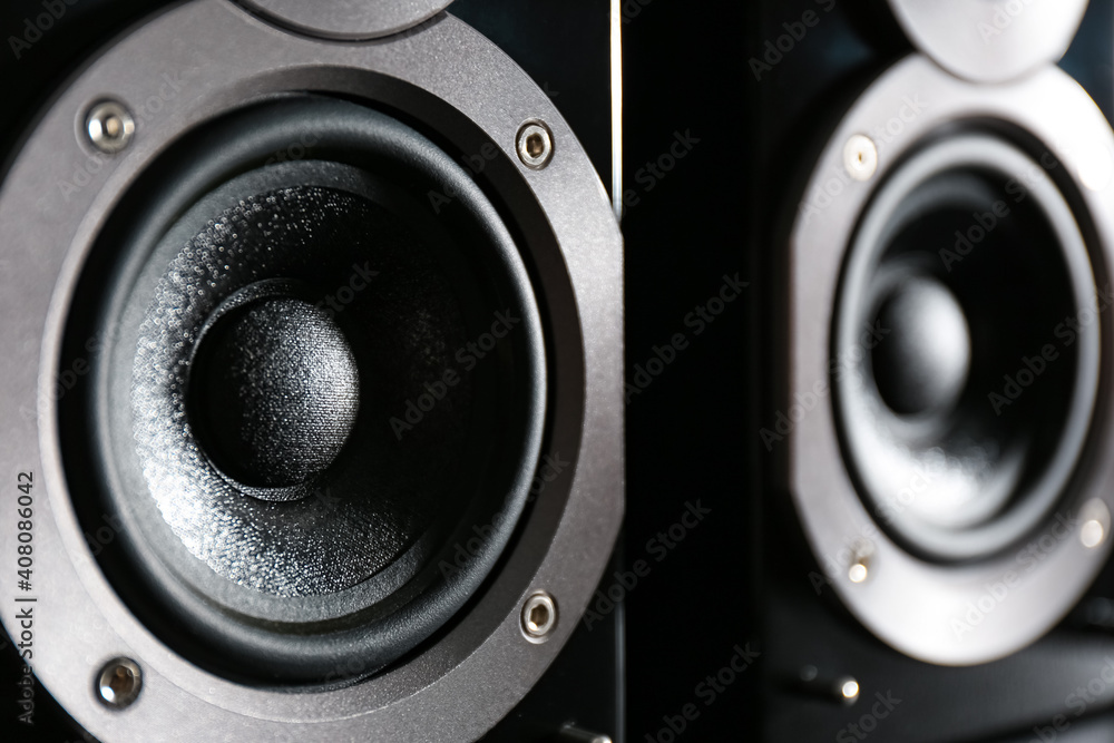 Modern powerful audio speakers as background, closeup Modern powerful audio speakers as background, closeup