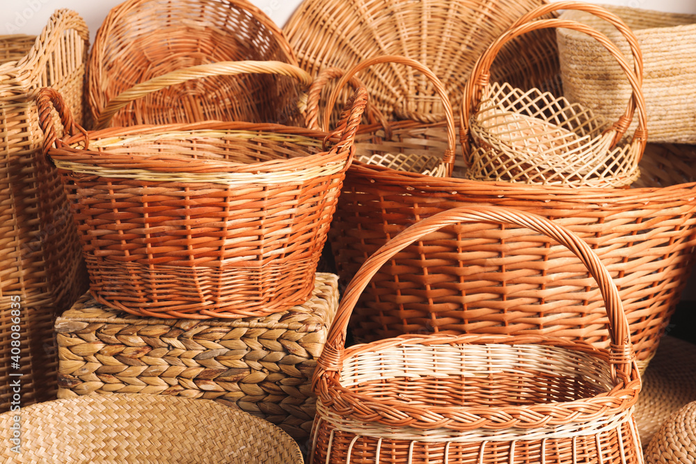Many different wicker baskets made of natural material as background, closeup Many different wicker baskets made of natural material as background, closeup