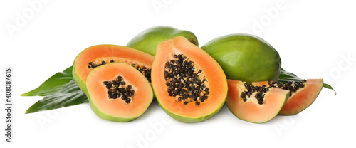 Fresh ripe papaya fruits with green leaves on white background
