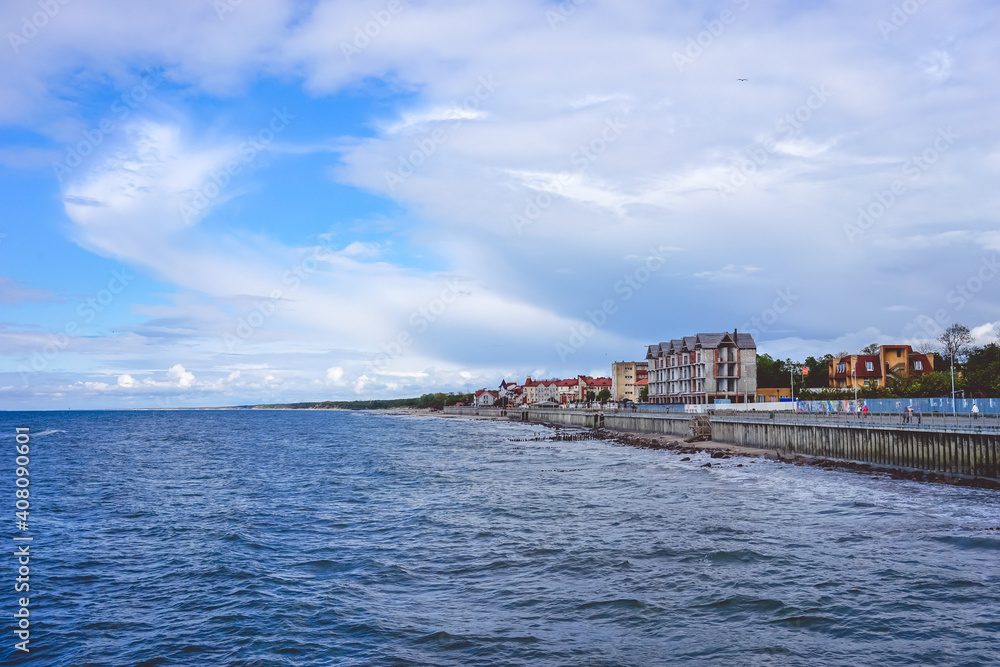 The sea with its long promenade and the historic resort town of Cranz.