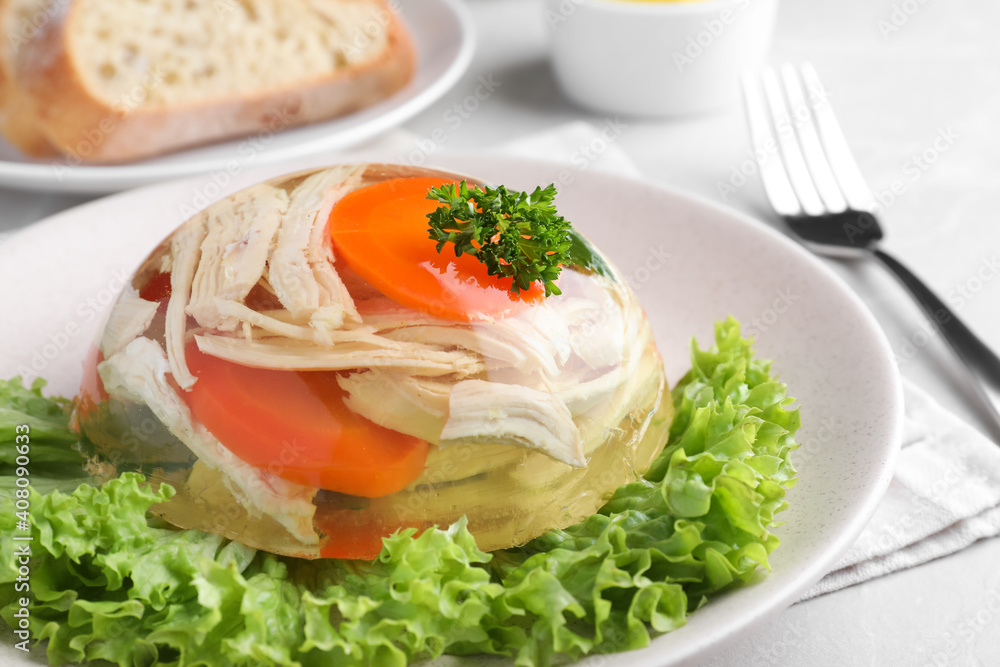 Delicious chicken aspic with vegetables on plate, closeup