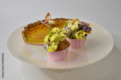 Cupcakes and cake in a glass bowl.