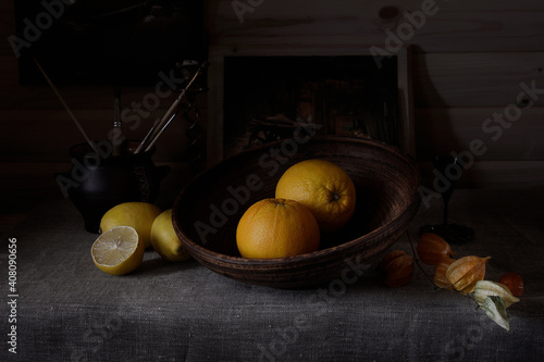 Citrus fruits on the table in ceramic dishes.