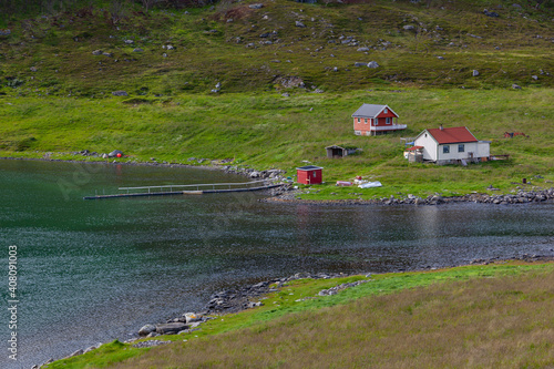 View on the turquoise gulf of the Barents sea and fishing village in the neighborhood of the Olderfjord, Norway. photo