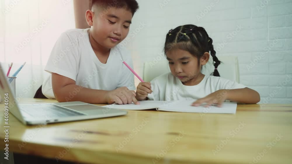 Asian boy and girl student online learning class study online with laptop at home. Asian boy and girl student online learning class study online with laptop at home.