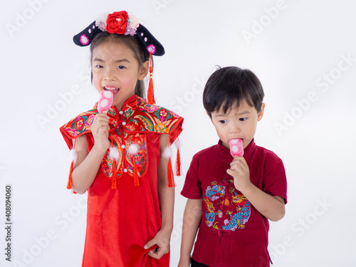 Happy Chinese new year. Asian boy and girl in cheongsam of traditional chinese dress on white background.