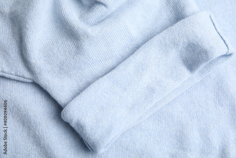 Fototapeta premium Warm cashmere sweater as background, top view