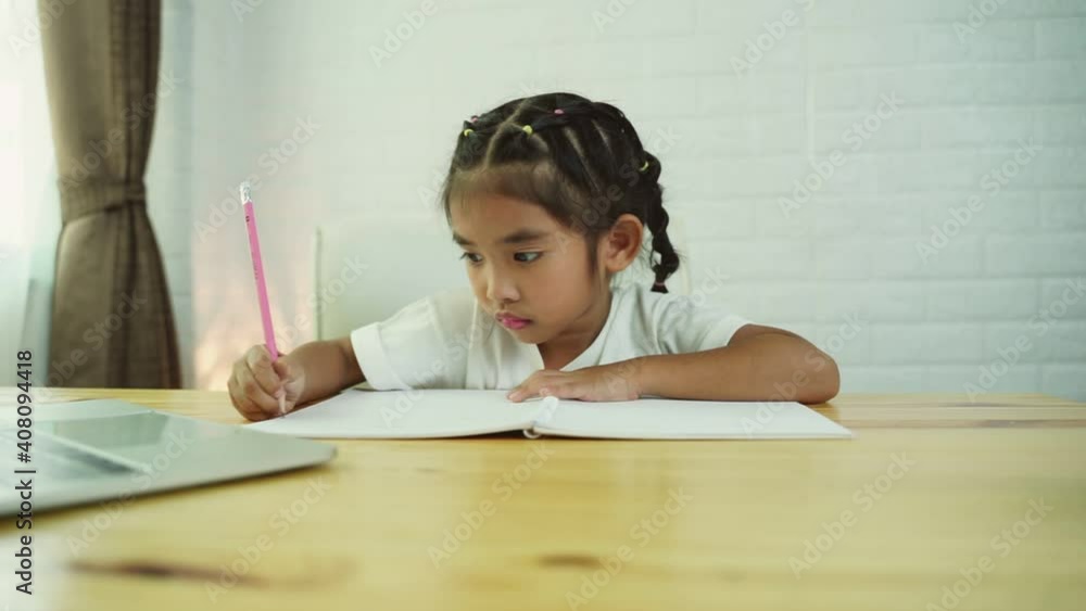 Asian cute girl student online learning class study online with laptop at home. Asian cute girl student online learning class study online with laptop at home.