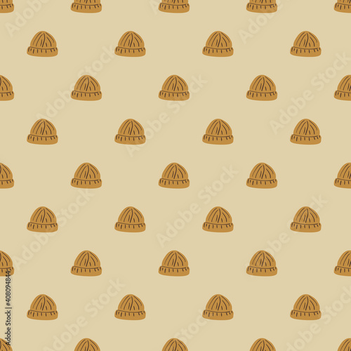 Fashion seamless doodle pattern with simple beige beanie hipster hat ornament. Pastel beige background.