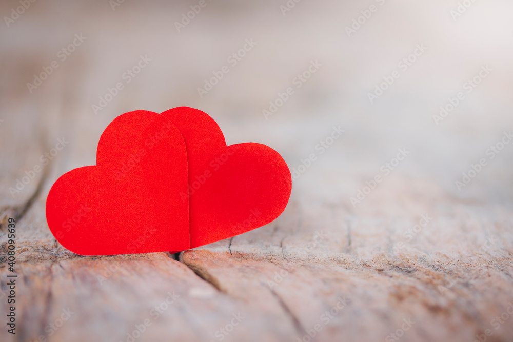 Close-up couple red heart on wood table to show status of love on Valentine's Day, Day of love, copy space, romantic concept for important day. Close-up couple red heart on wood table to show status of love on Valentine's Day, Day of love, copy space, romantic concept for important day.